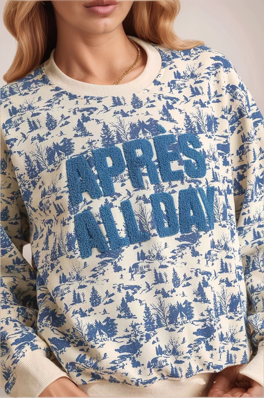 Sweatshirt with 'Apres All Day' text and winter landscape design