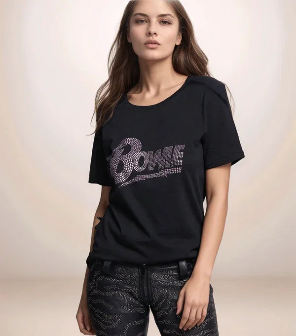 Woman wearing a black t-shirt with 'Bowie' design on a plain background
