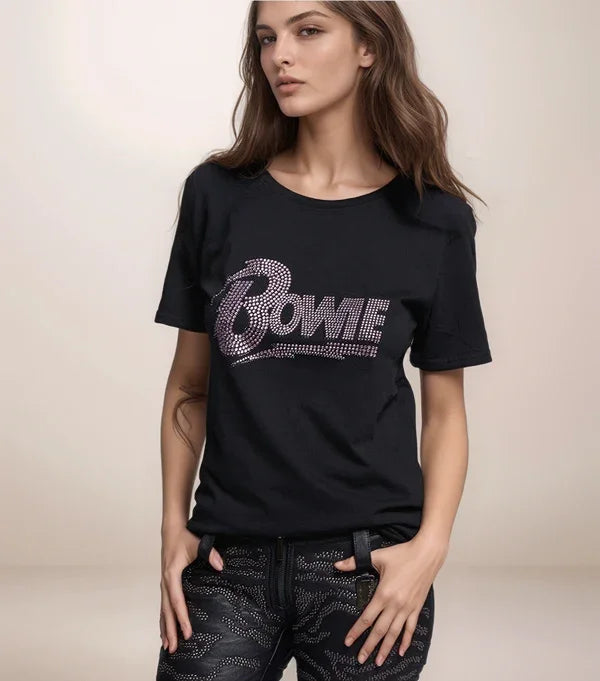 Person wearing a black t-shirt with 'Bowie' design on a plain background
