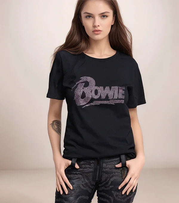 Person wearing a black t-shirt with 'Bowie' text, standing against a plain background