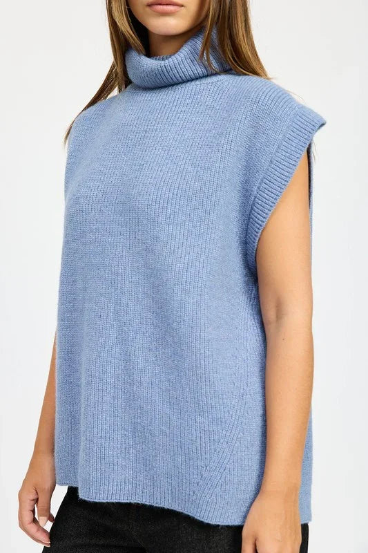 Light blue sleeveless sweater with a turtleneck on a white background