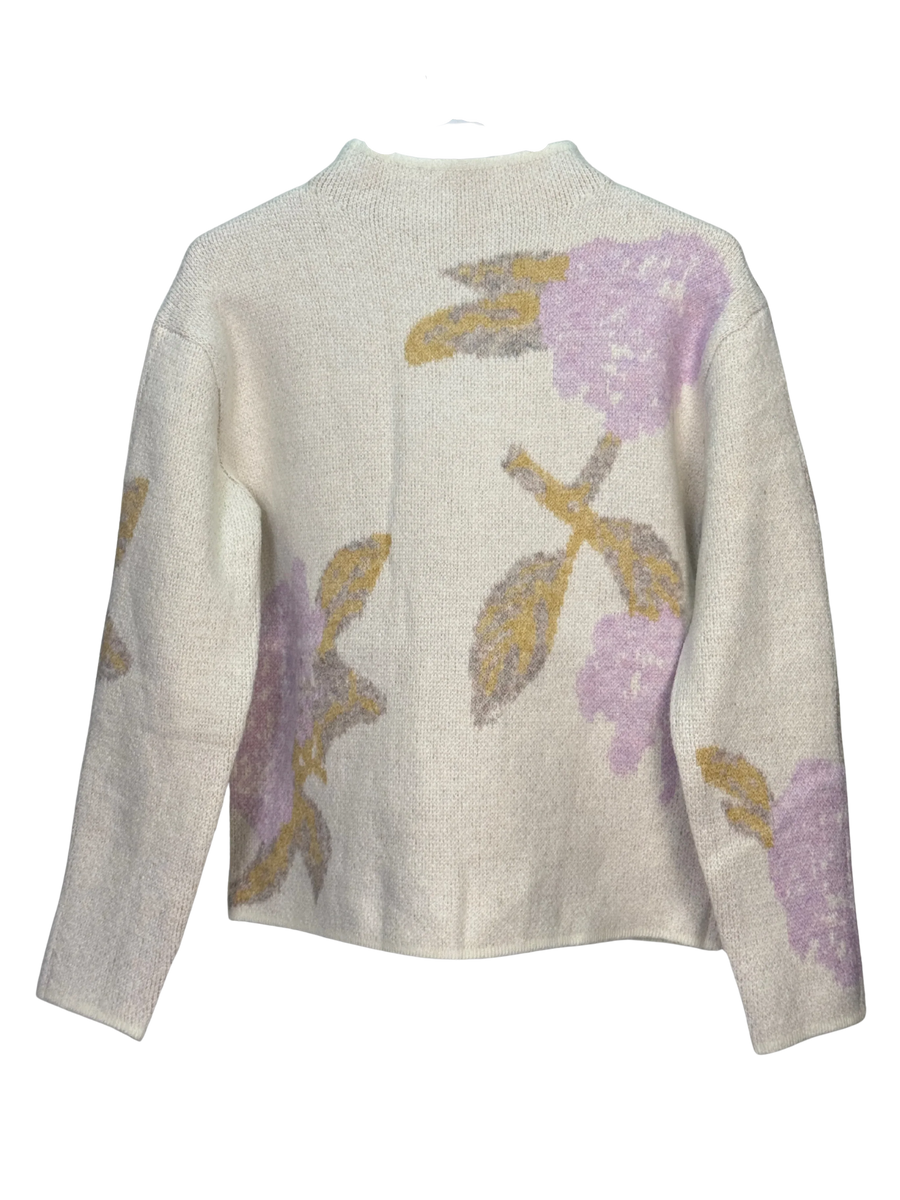 Floral patterned sweater on a white background