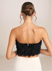 Black strapless top with sequin details on a plain background