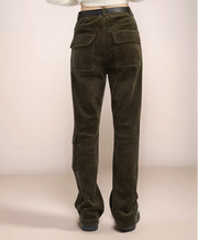 olive green corduroy pants on a plain background