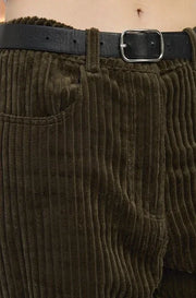 olive green  corduroy pants with a black belt and silver buckle.
