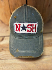Distressed blue cap with 'NASH' patch on a wooden surface