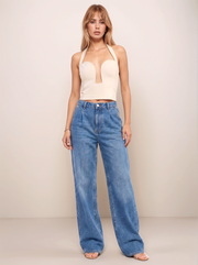 Halter Neck Cutout Top  lifestyle view in cream styled with wide leg denim jeans