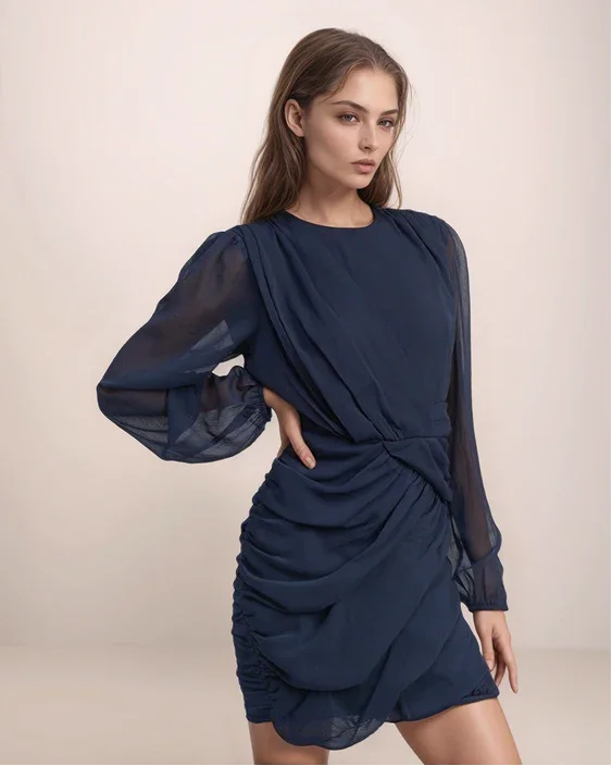 model in a long sleeve navy blue ruched dress with a neutral background