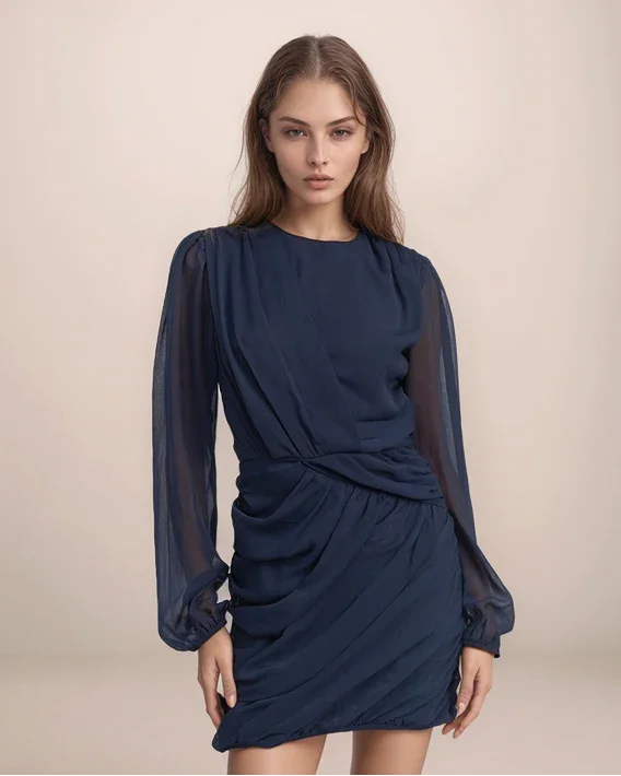 model wearing a navy blue draped dress with ruching on a neutral background