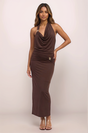 Full-body front view of a model wearing the espresso brown Aurelia cowl neck top paired with the matching maxi skirt, showcasing the monochromatic set's smoothing, high-stretch fit and elegant silhouette.