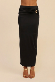 Front view of the black Aurelia maxi skirt, showcasing the smoothing nylon-spandex fit and the elegant side-ruching that gathers at the left hip.