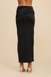Back view of the black Aurelia lined maxi skirt, highlighting the clean body-con silhouette and the high-stretch fabric's ability to maintain a sleek, opaque finish.