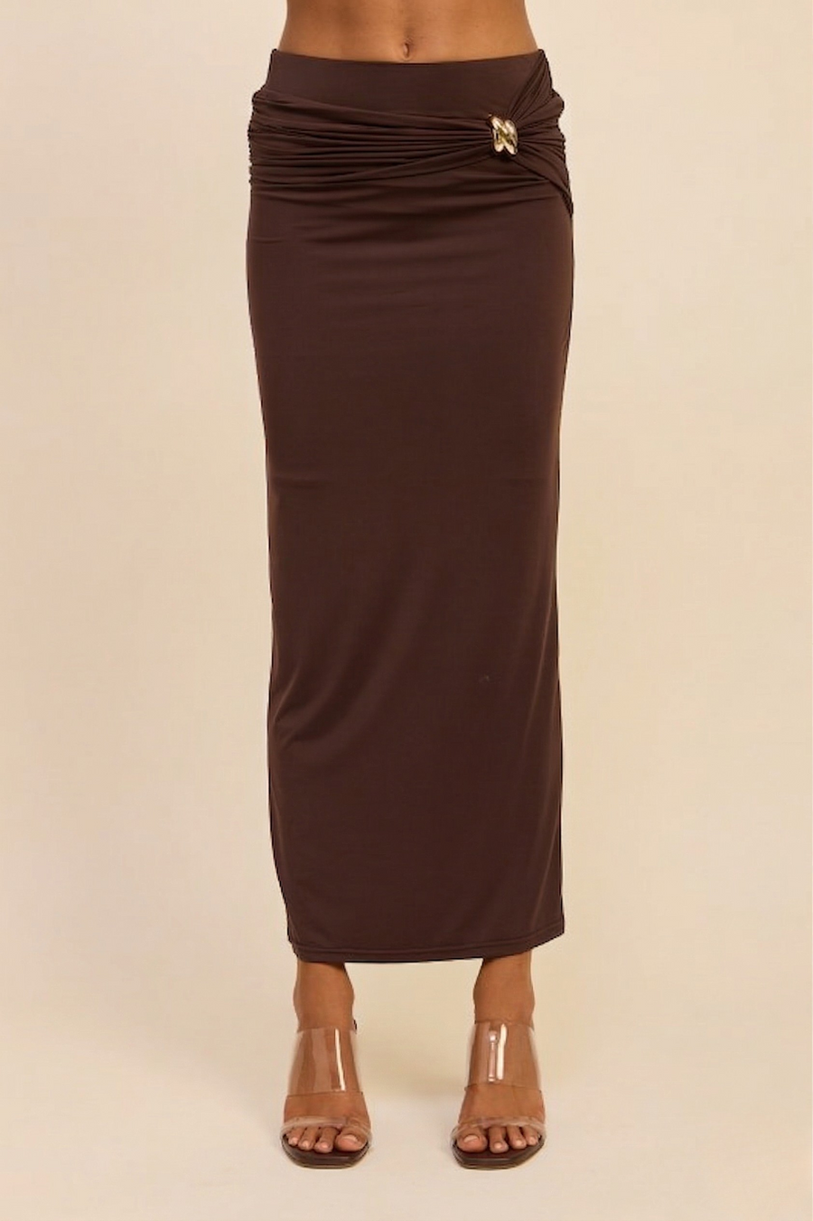 Front view of the brown Aurelia maxi skirt, showcasing the smoothing nylon-spandex fit and the elegant side-ruching that gathers at the left hip.
