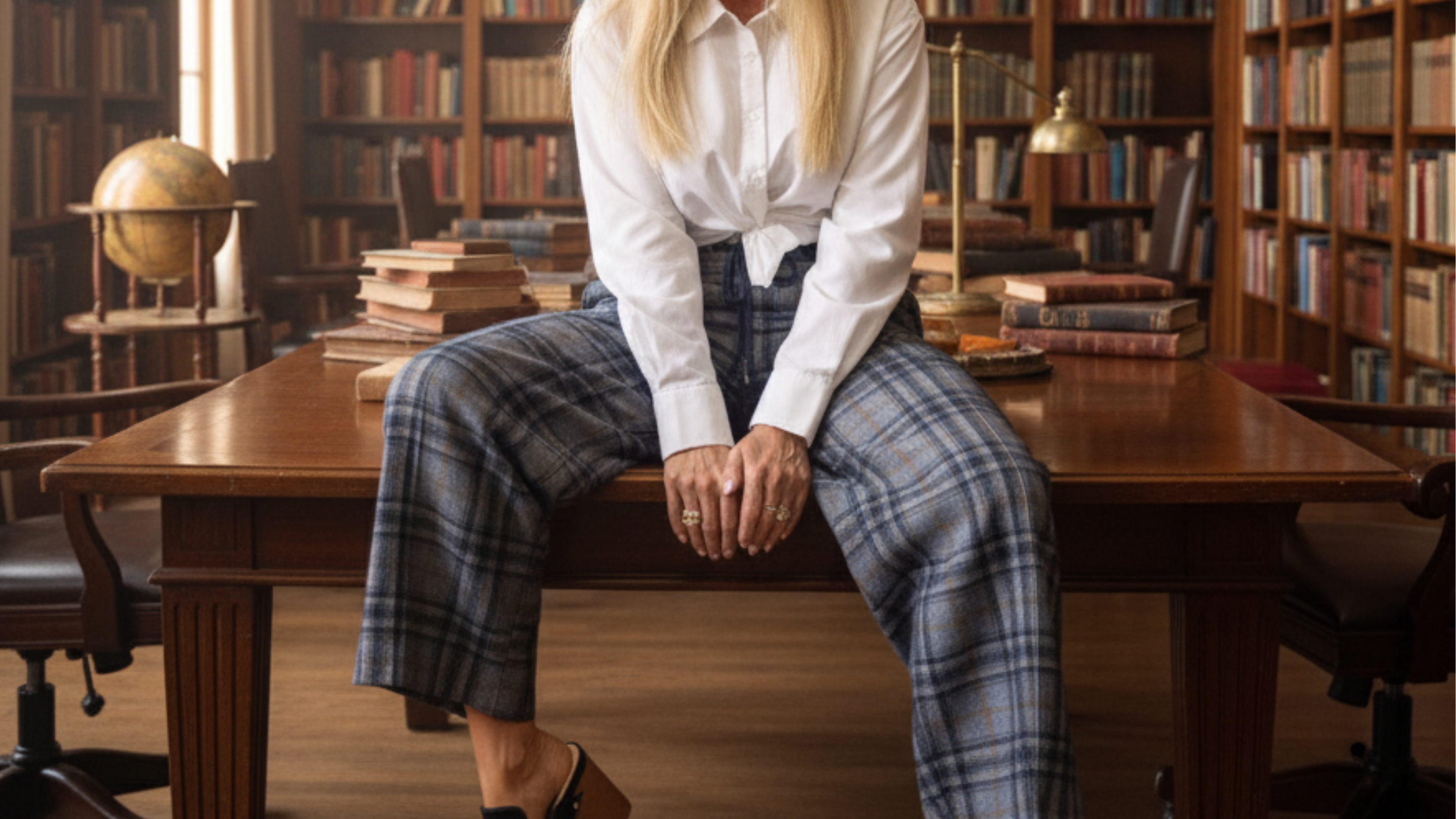 Person sitting at a desk in a library setting