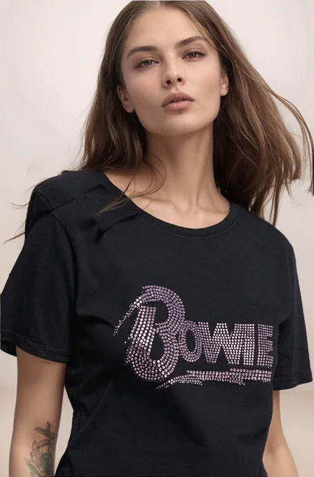 Woman wearing a black t-shirt with 'Bowie' text in rhinestones against a plain background