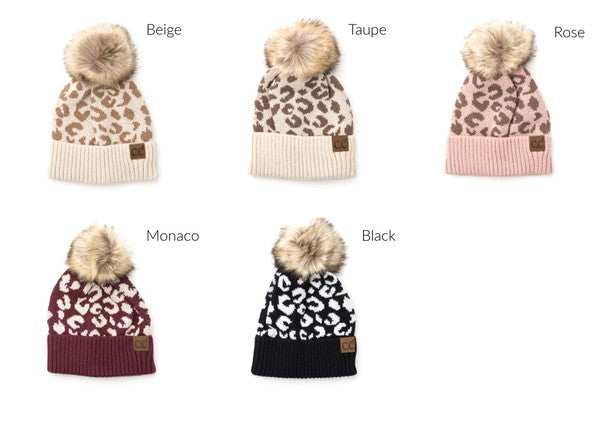 Collection of leopard print beanies with pom-poms in various colors on a white background.