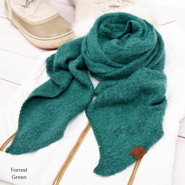 Teal scarf with a brand logo on a light background