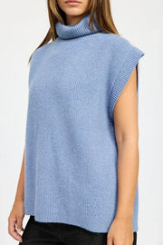 Light blue sleeveless sweater with a turtleneck on a white background