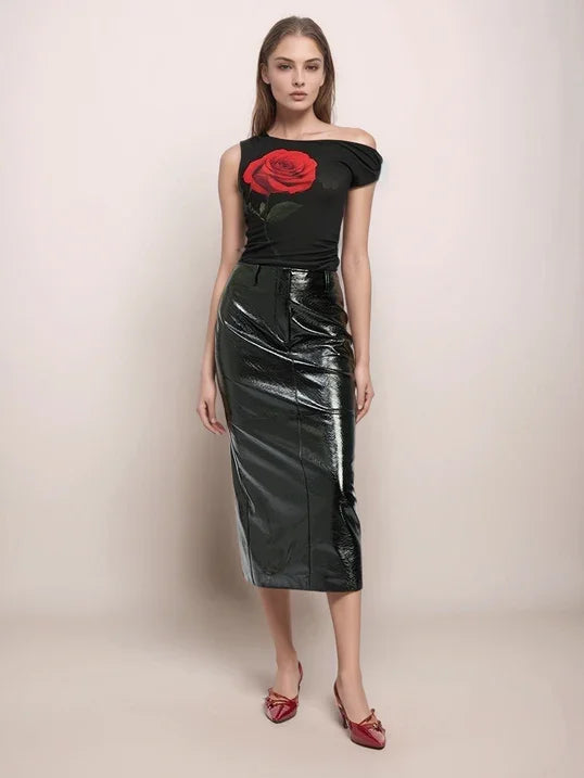 a woman wearing a black leather pencil skirt and a black top in front of a neutral background