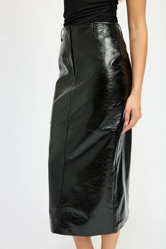 Black leather skirt worn by a person on a white background