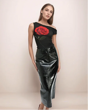 a woman wearing a black leather skirt and a black top