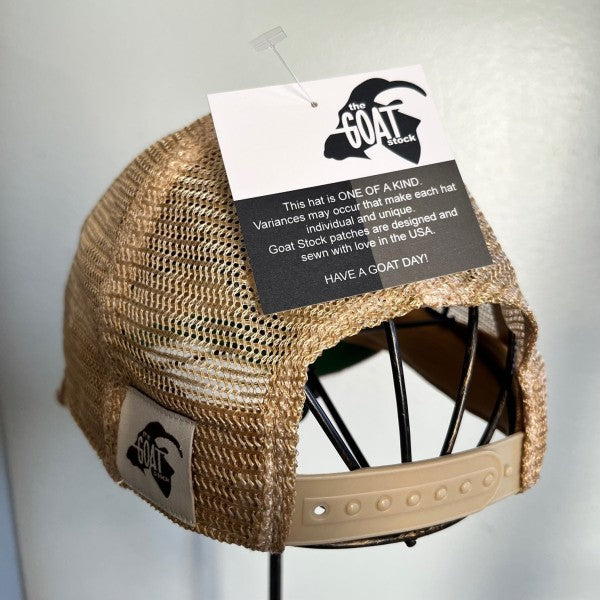 Beige mesh cap with brand tag on a gray background