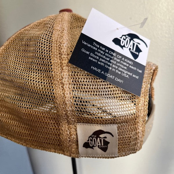 Beige mesh cap with a brand tag on a neutral background