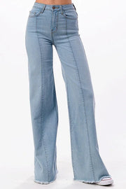 Light blue flared jeans on a white background