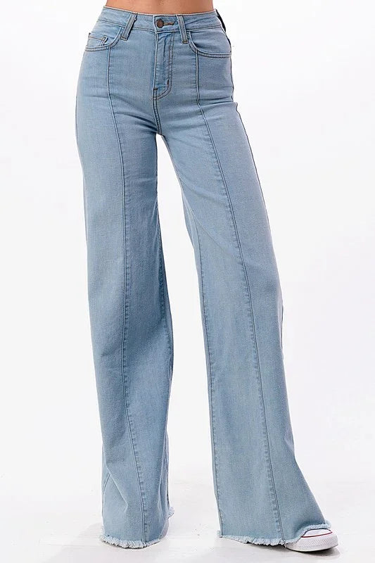 Light blue flared jeans on a white background