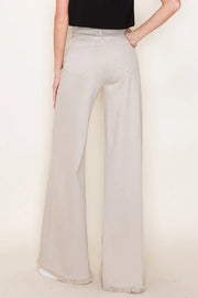 Light khaki wide-leg pants worn by a person on a plain background