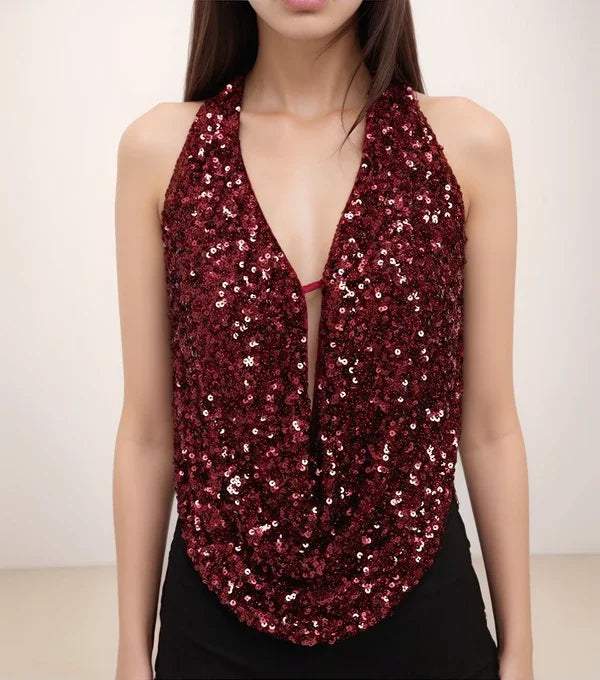 Red sequin halter top worn by a model on a plain background