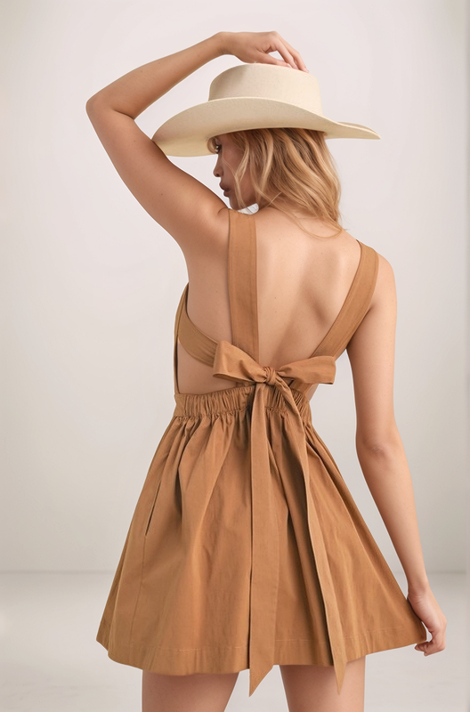 Chocolate Maeve mini dress back view with open back, wide shoulder straps, tie-back detail, and elastic waist