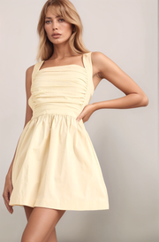 Oat Maeve mini dress front view with smocked bodice, square neckline, wide straps, and A-line skirt