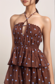 Close-up of the Maren halter neckline and fitted bodice highlighting the brown polka dot chiffon fabric and gathered waist detail.