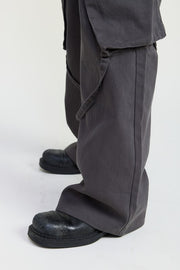 Dark gray pants and black shoes on a white background