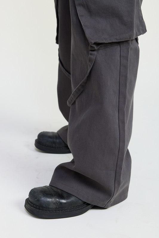 Dark gray pants and black shoes on a white background