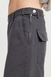 Dark gray cargo pants with a white background
