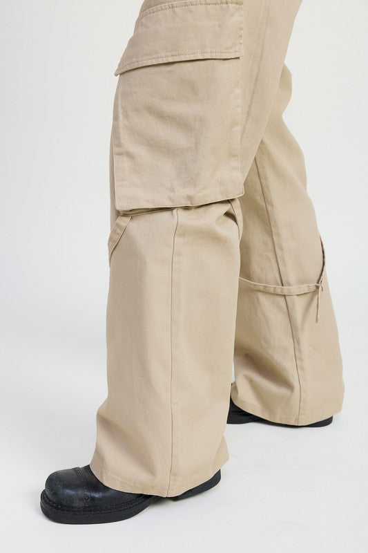 Beige cargo pants worn by a person on a white background