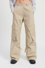 Beige cargo pants worn by a person on a white background