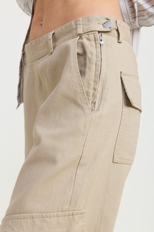 Beige cargo pants with a white background