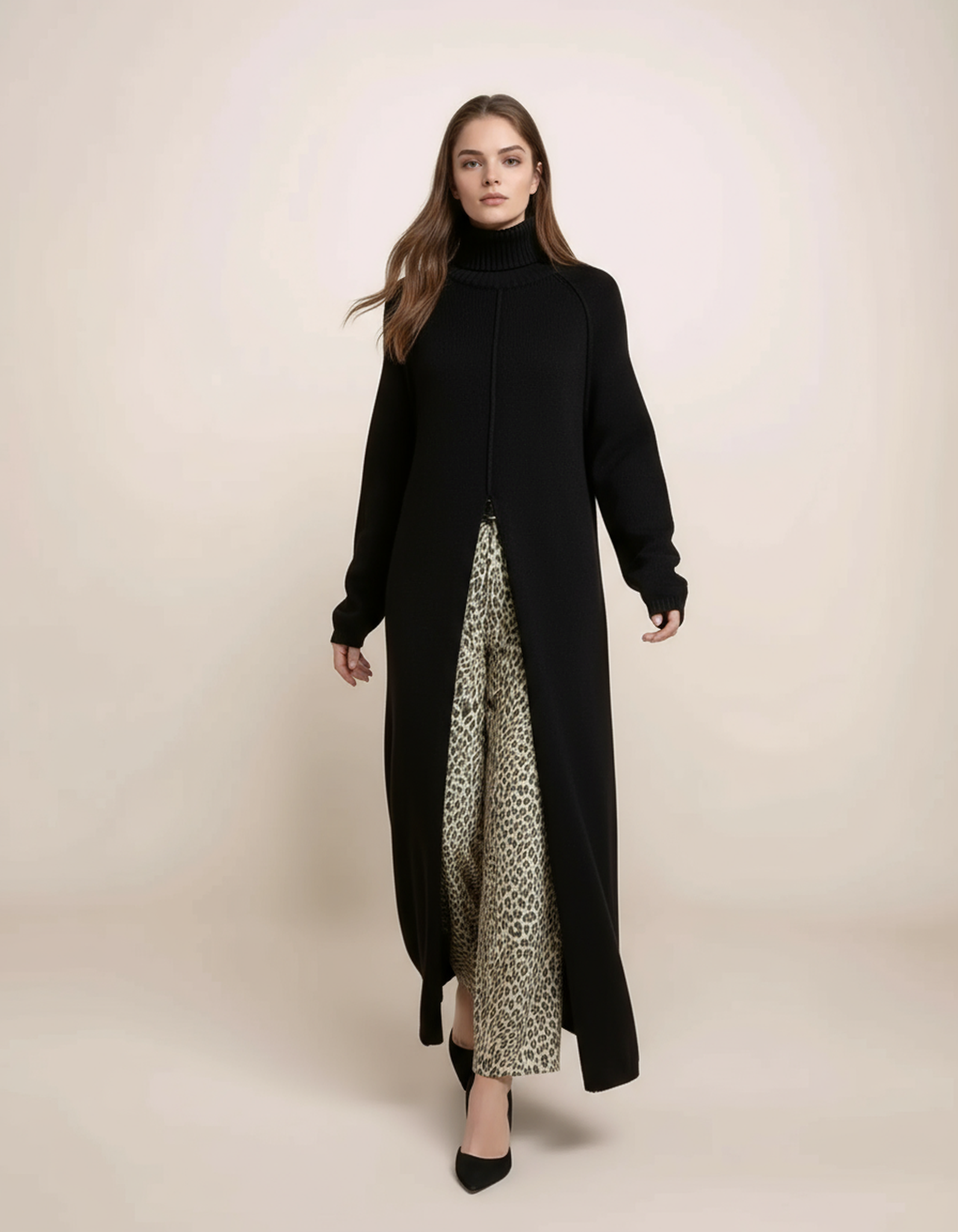 Woman wearing a long black dress with a leopard print skirt on a beige background