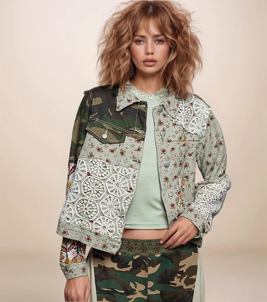 a woman is wearing a floral and camo patchwork jacket with lace contrast. 