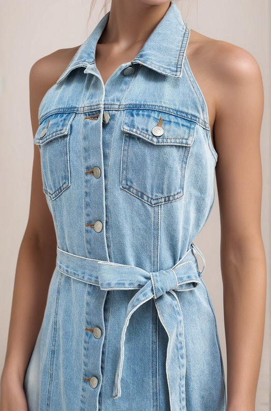 Close-up of cotton denim halter dress with button-front detail and chest pockets
