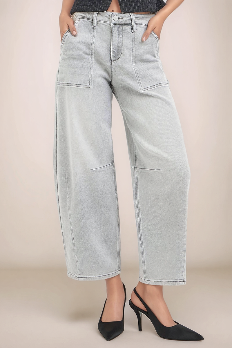 Close front view of RISEN light wash slouchy cropped barrel jeans with curved leg silhouette and front patch pockets