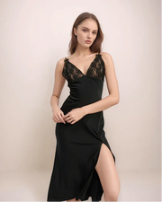 a woman wearing a black lace sip dress