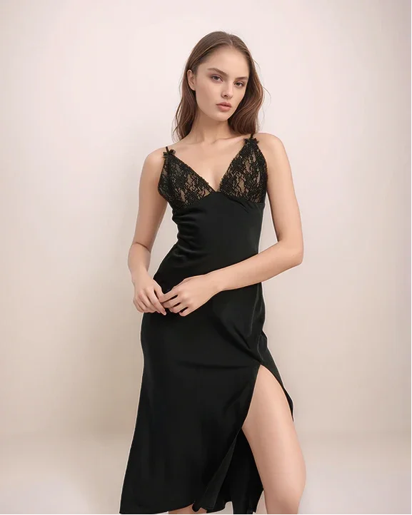 a woman wearing a black lace sip dress