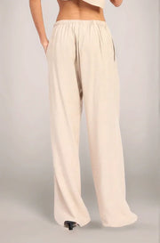 Back view of the Sonora Rayon-Linen pants, showcasing the relaxed, wide-leg silhouette and the clean drape of the fully lined fabric.