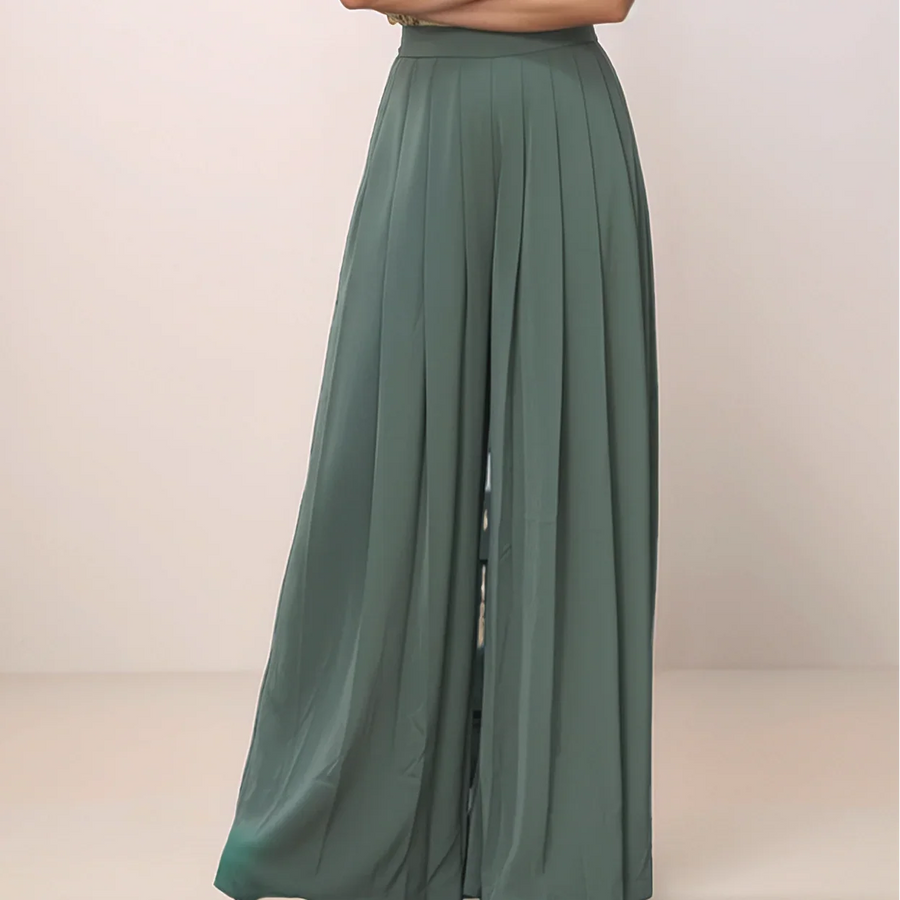 green wide leg pants against a plain background